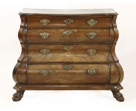 A Dutch mahogany bombé commode, late 18th century, the four long drawers with shaped corners on claw and ball feet,91cm wide5