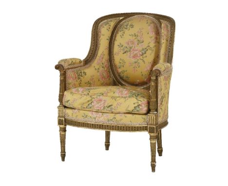 A French giltwood fauteuil armchair,in the Louis XVI style with floral figured gold damask upholstery centred with an oval ba