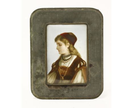 A porcelain Plaque,   late 19th century, painted with a half-length portrait of a girl in traditional costume,14 x 9.5cmThe O