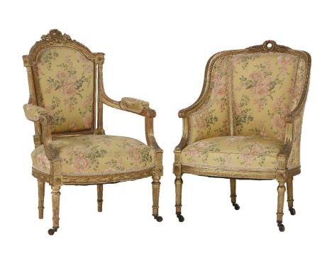 A French giltwood fauteuil armchair,19th century, upholstered in floral figured gold damask, the ornately carved frame surmou
