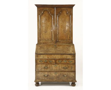 A George II burr walnut bureau bookcase,  crossbanded and with herringbone inlay and applied moulding, the upper section with