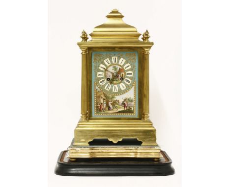 A French gilt metal mantel clock, late 19th century, inset with porcelain panels depicting rural folk dancing, 38cm high, on 
