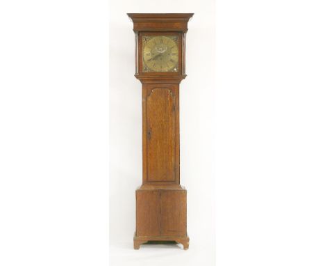 An oak longcase clock, 19th century, with a three-train musical movement, striking the quarters on eight bells, the brass dia