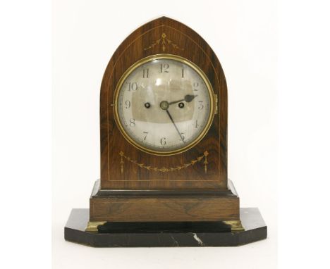 A Regency rosewood bracket clock,of lancet shape with strung and inlaid decoration, striking on a gong, now with a marble pli