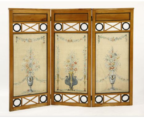 A Biedermeier birch three-fold screen,each panel with a trellis pierced frieze and painted silk panels,124.5cm high155cm wide