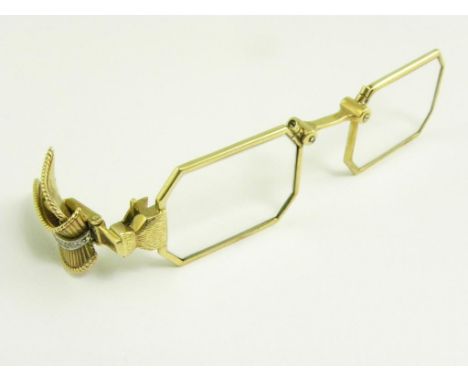 A FRENCH GOLD LORGNETTE WITH OCTAGONAL FRAMES AND DIAMOND SET DOUBLE LEAF CLIP HANDLE