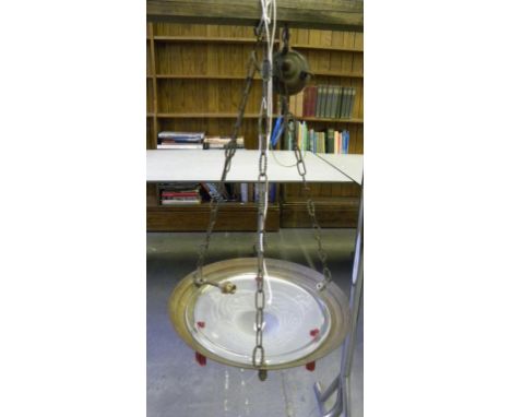 AN ART DECO FROSTED GLASS AND STAMPED BRASS HANGING LIGHT