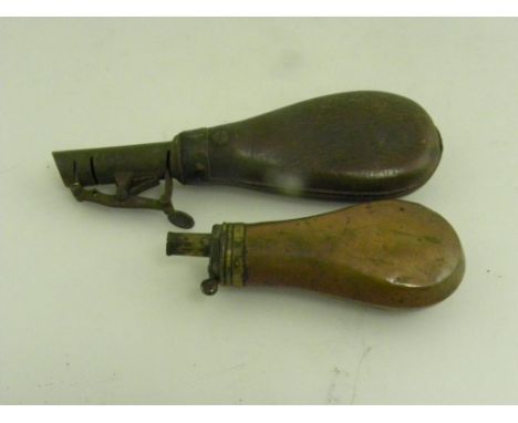 AN EARLY 19TH CENTURY ENGLISH BRASS MOUNTED COPPER PISTOL FLASK AND A VICTORIAN STEEL AND LEATHER SHOT FLASK