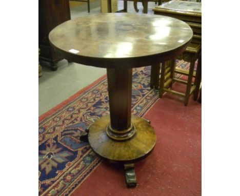 AN EARLY VICTORIAN MAHOGANY LAMP TABLE ON PLATFORM AND THREE WEDGE FEET