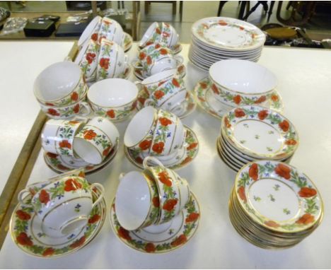 A CONTINENTAL PORCELAIN TEA SERVICE, PAINTED PRINCIPALLY IN RED AND GREEN WITH BORDERS OF STYLISED FLOWERS, C1820