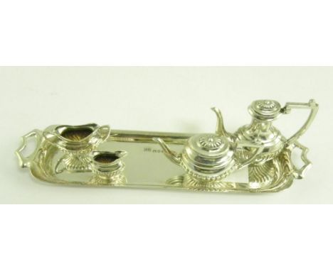 AN ELIZABETH II SILVER MINIATURE TEA AND COFFEE SERVICE INCLUDING A TRAY, LONDON 1975, 2OZS