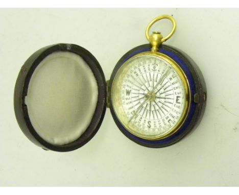 A VICTORIAN GILT BRASS COMPASS IN MAROON MOROCCO CASE