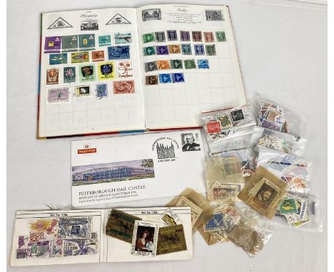 A vintage stamp album of assorted mid century world stamps together with a quantity of loose stamps, a small stamp album and 