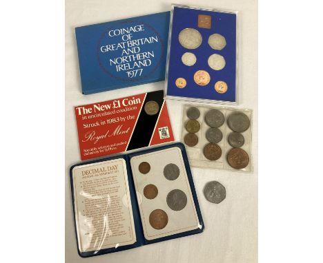 4 vintage coin sets. A cased 1977 coinage of Great Britain proof set, a sealed uncirculated 1983 £1 coin from Ty-phoo, a seal