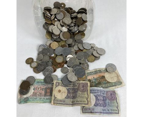 A collection of vintage foreign coins and bank notes. To include examples from India, Germany, Ireland, Italy and America. 