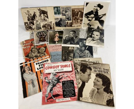 A collection of vintage film related magazines, newspaper cuttings, promotional photographs and a scrapbook. To include colou