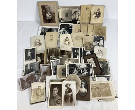 A collection of assorted Victorian &amp; vintage photographs and cabinet cards. To include studio portraits, military uniform