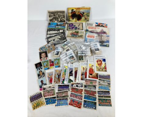 A collection of assorted vintage ephemera to include postcards, chewing gum cards and Brooke Bond tea cards &amp; albums. Lot