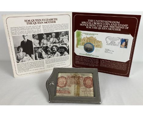 A vintage 10 shilling note in a silver plated frame. Together with a presentation folder containing a "First Day Cover Queen 