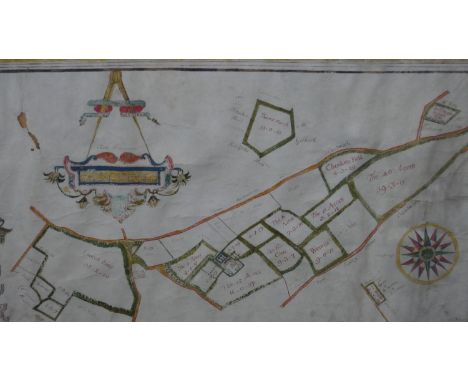 A framed and glazed 17th century hand drawn map showing the land owned by the Manor of Grove, with hand written description a