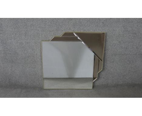 A contemporary Art Deco style frameless mirror, with a bevelled square mirror plate, having a canted corner, with other bevel