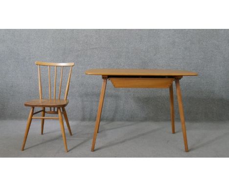 An Ercol elm dining table, the top with rounded corners, over a single drawer, on splayed legs, label to the underside, toget