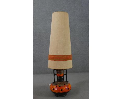 A mid century West German twin handled design fat lava ceramic lamp with embellished fabric shade. H.124cm. 