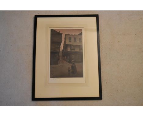 Cecil Alden (1870–1935) - A framed and glazed print depicting evening street scene, with printer hallmark and signature. H.69