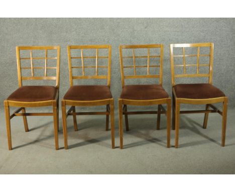 A set of vintage Heal's style dining chairs, with lattice backs, over a brown velour drop in seat, the legs joined by H stret