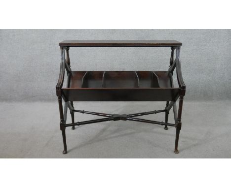 A George III style mahogany book trough stand, with a rectangular shelf over turned supports, above a trough with dividers, t