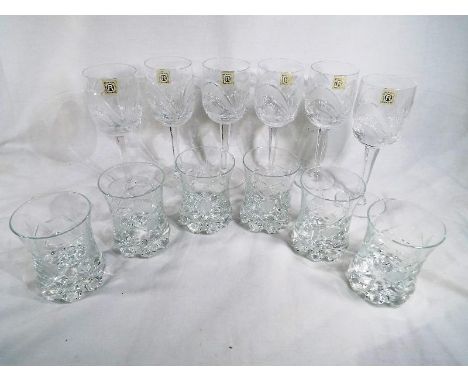 A glass decanter with a matching set of six heavy good quality Boris- Kidric wine glasses and a set of six good quality drink