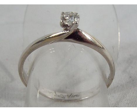 An 18 carat gold diamond solitaire, size K and a half, approximate weight 1.46 grams. Estimate £60 - £80