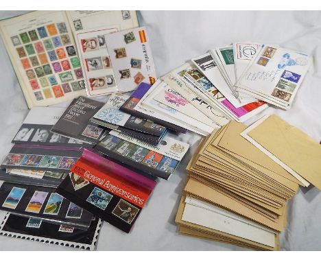 Philately - a mixed lot to include an album of early 20th century and later UK and world postage stamps, a further collection