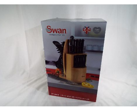 Unused surplus retail stock (not returns) - a Swan 31-piece kitchen tool set and pine block - Est £25 - £40