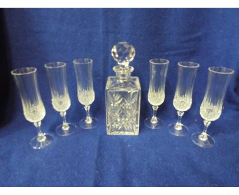 A good quality glass decanter with six glass flutes (qty)