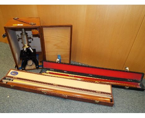 A good quality cased Prior microscope and two cased snooker cues by Formula and Amfax (3)