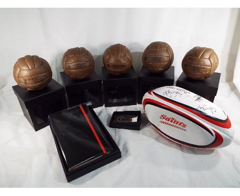 Manchester United football memorabilia - a collection of five executive club replica footballs commemorating Manchester Unite