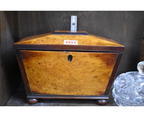 A Regency burr elm and rosewood banded sarcophagus tea caddy,&nbsp;25cm wide.&nbsp; 