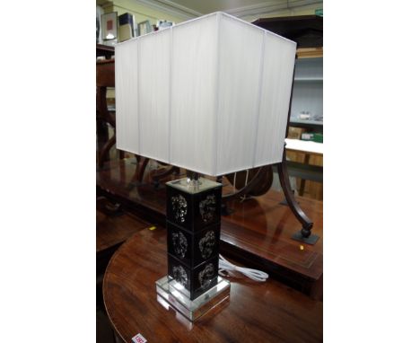 A contemporary table lamp. 