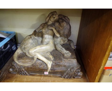 A large Goldscheider pottery figure group of a girl and lion,&nbsp;impressed marks, 62cm wide. 