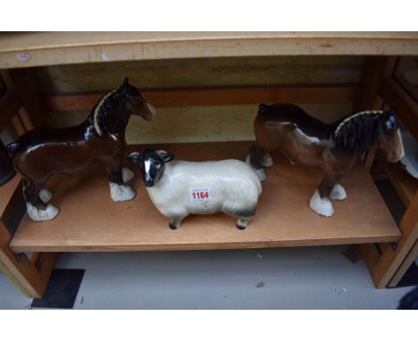 Two Beswick Shire horses; together with a similar model of a sheep. 