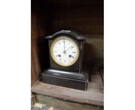 A Victorian slate mantel clock,&nbsp;19.5cm high, with pendulum. 