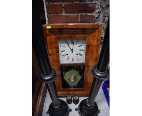 A late 19th century American mahogany wall clock, by Waterbury Clock Co, 66cm high. 