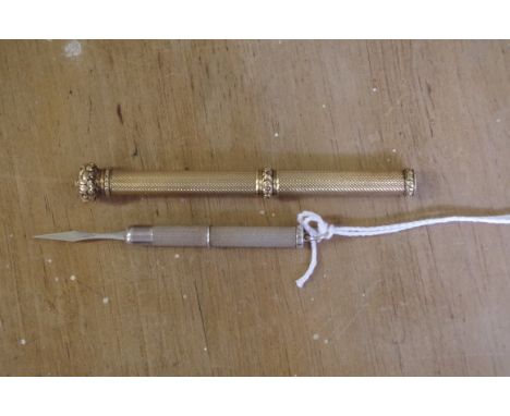 A Victorian gilt engine turned metal propelling pencil, inscribed 'Butler &amp; Co, Makers, London'; together with a silver e