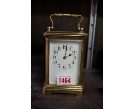 An old brass carriage clock, striking on a gong, height including handle 16cm.&nbsp; 