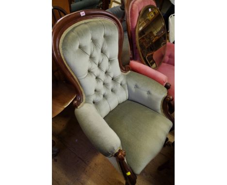 A near pair of Victorian button upholstered occasional arm chairs. 