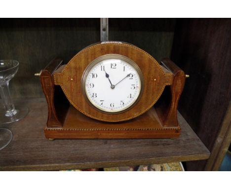 An unusual Edwardian mahogany and inlaid mantel timepiece, in adjustable cheval style mount, 27cm wide. 