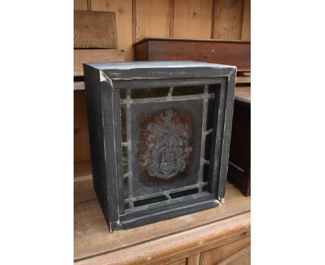 A stained and leaded glass panel, 28 x 23cm, set in ebonized box.&nbsp; 