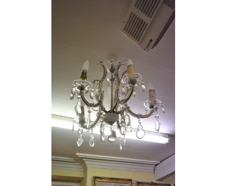 An old glass and brass five branch chandelier.&nbsp; 