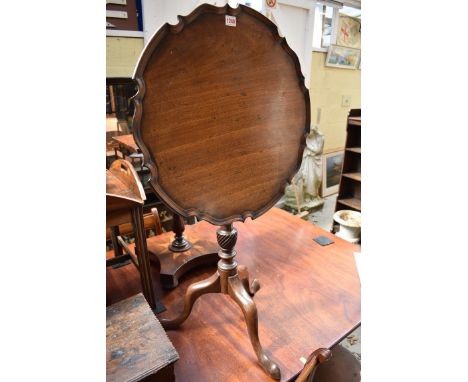 An antique mahogany tilt top tripod table, with piecrust top, 57cm diameter.&nbsp; 